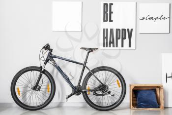 Modern bicycle in interior of room�