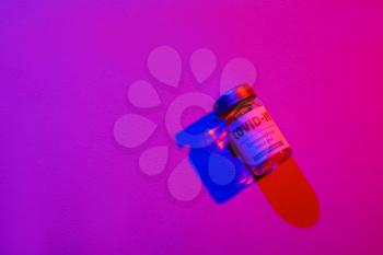 Vaccine for immunization against COVID-19 on color background�