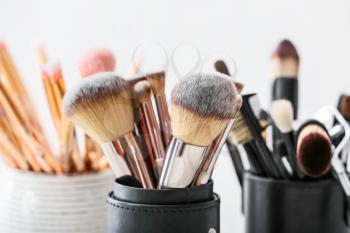 Set of makeup brushes on light background, closeup�