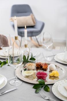 Passover Seder plate with traditional food on served table�