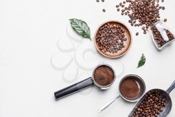 Composition with coffee beans and powder on light background�