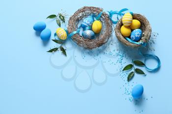 Composition with beautiful Easter eggs on color background�