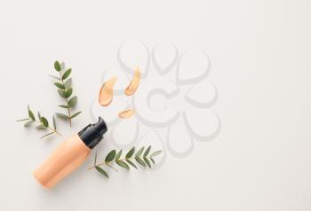 Concealer and green branches on white background�
