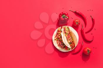 Plate with tasty tacos and fresh vegetables on color background�