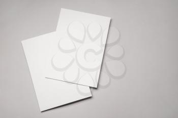 Blank sheets of paper on grey background�