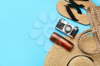 Set of beach accessories on color background�