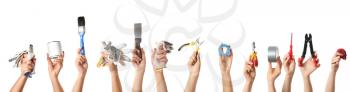 Female hands with different construction tools on white background�