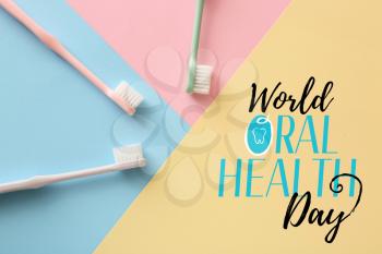 Tooth brushes on color background. World Oral Health Day�