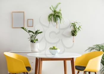 Interior of modern stylish dining room with houseplants�