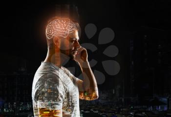 Double exposure of man with glowing brain and city�