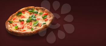 Delicious pizza Margherita on dark color background�