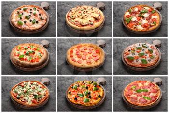Set of tasty Italian pizzas on grey background�