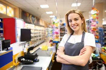 Portrait of female cashier in supermarket�