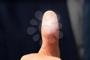 Businessman using fingerprint protection for data access, closeup�