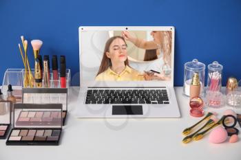 Workplace of professional makeup artist with modern laptop�