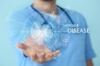 Endocrinologist using virtual screen on color background. Thyroid disease concept�