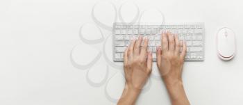 Female hands with computer keyboard on white background with space for text�
