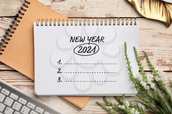 Notebook with empty to-do list for 2021 year on white wooden background�