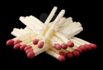 Royalty Free Photo of Red Matchsticks on a Black Background