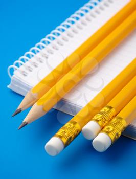 Royalty Free Photo of Pencils and a Notepad