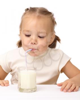 Royalty Free Photo of a Little Girl Drinking Milk Through a Straw