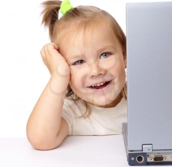 Royalty Free Photo of a Little Girl With a Laptop