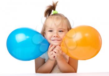 Royalty Free Photo of a Girl With Balloons