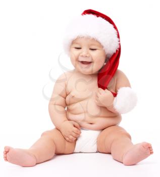 Royalty Free Photo of a Baby Wearing a Santa Hat