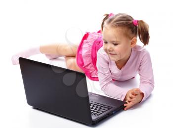 Royalty Free Photo of a Little Girl on the Floor With a Laptop