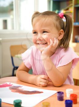 Royalty Free Photo of a Little Girl Painting