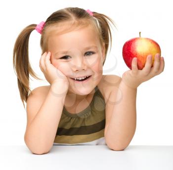 Royalty Free Photo of a Little Girl With an Apple