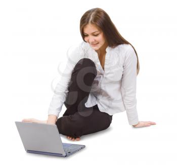 Royalty Free Photo of a Girl on the Floor With a Laptop