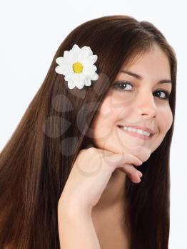 Royalty Free Photo of a Young Girl With a Flower in Her Hair