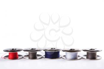 Royalty Free Photo of Metal Spools With Multi-Coloured Thread