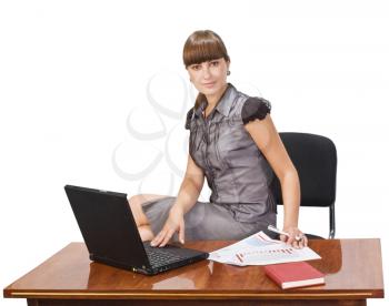 Royalty Free Photo of a Woman at a Desk With a Laptop