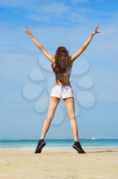 Royalty Free Photo of a Happy Woman at the Beach