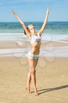 Royalty Free Photo of a Woman Exercising on the Beach