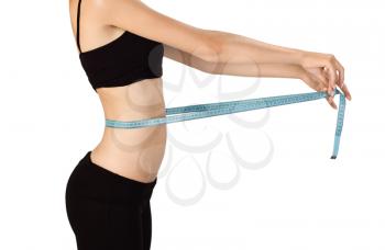 Royalty Free Photo of a Girl Measuring Her Waistline