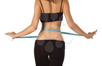 Royalty Free Photo of a Girl Measuring Her Waist