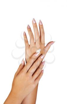 Royalty Free Photo of a Woman Rubbing Moisturizer Onto Her Hands