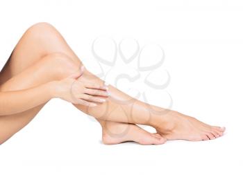 Royalty Free Photo of a Woman's Legs Having Cream Aplied