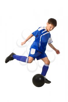 Royalty Free Photo of a Boy Playing Football