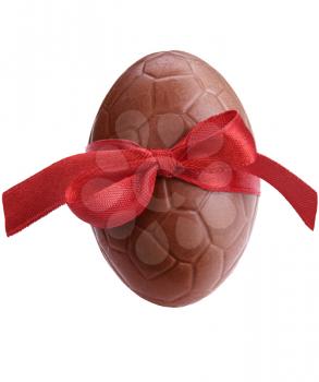 Chocolate easter egg with a red ribbon isolated on white