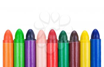 Several different colours wax crayons isolated on white background