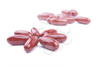 Some of brown pills isolated on a white background