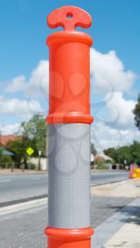 image of T Top Temporary Bollard  with reflect collar on the street