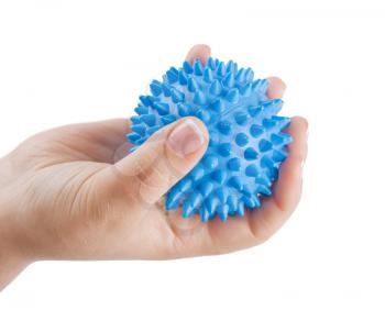Woman's hand with Spiny plastic blue massage ball isolated on white background