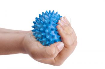 Woman's hand with Spiny plastic blue massage ball isolated on white
