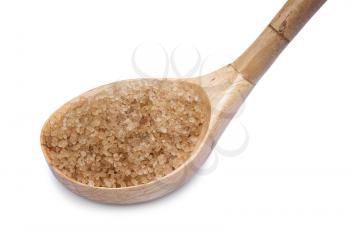 Brown sugar with wooden spoon on white background 