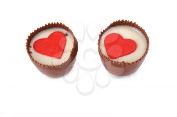 two chocolates with an ornament in the form of hearts